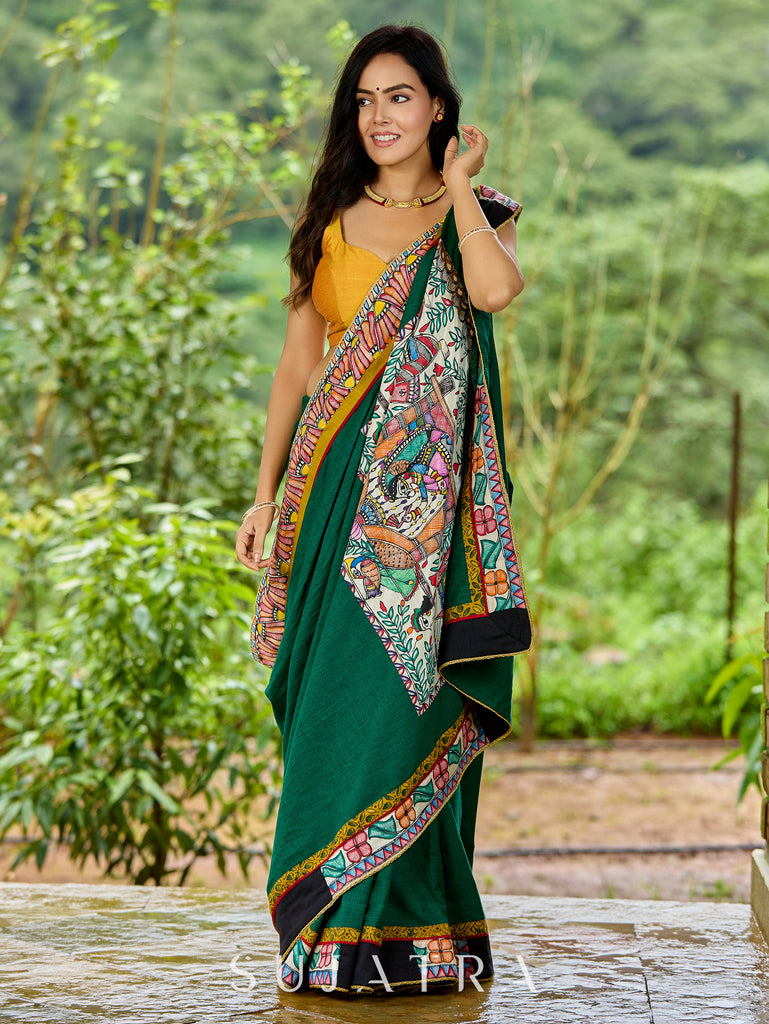 Artisanal cotton saree in bold green with Madhubani hand painted charm