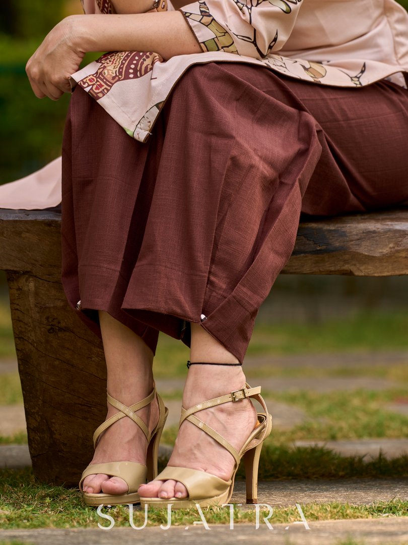 Stylish brown pleated pants with clean pleats and a polished finish