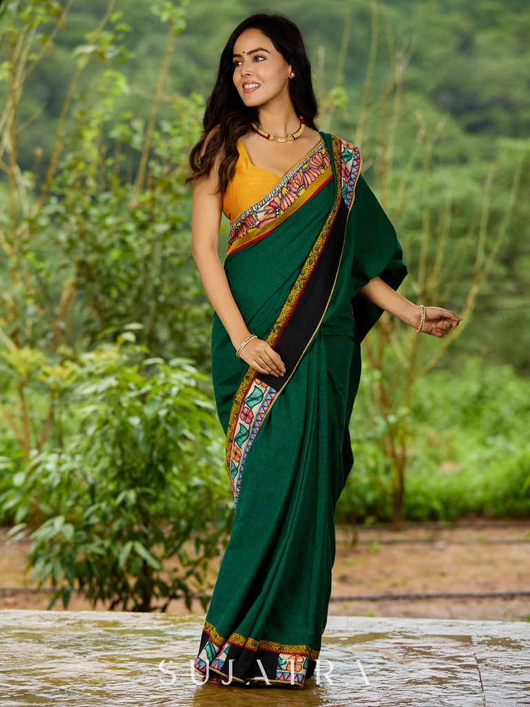 Artisanal cotton saree in bold green with Madhubani hand painted charm