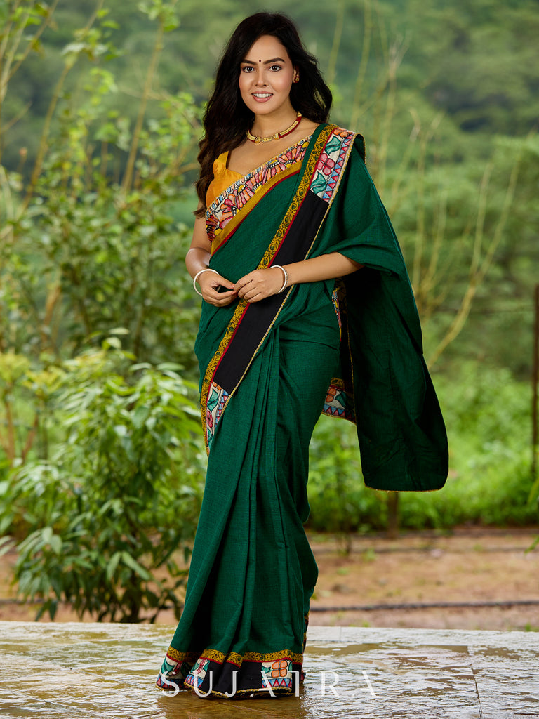 Artisanal cotton saree in bold green with Madhubani hand painted charm