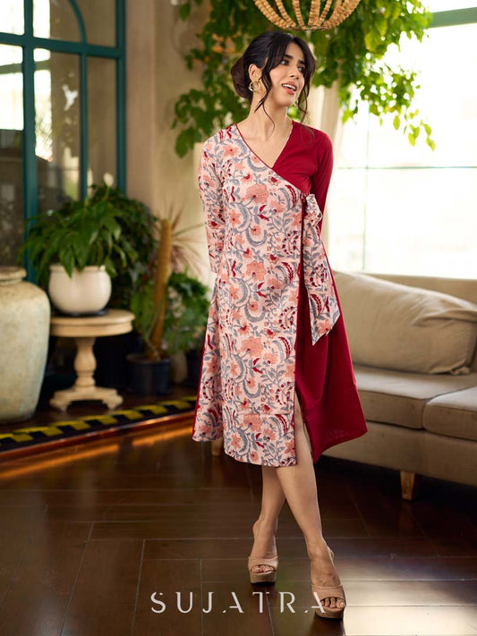 Jaipur-printed maroon floral crossover dress featuring a wrap-style silhouette with a coordinating floral tie-up, creating a flattering cinched waist and a breezy, feminine flow.