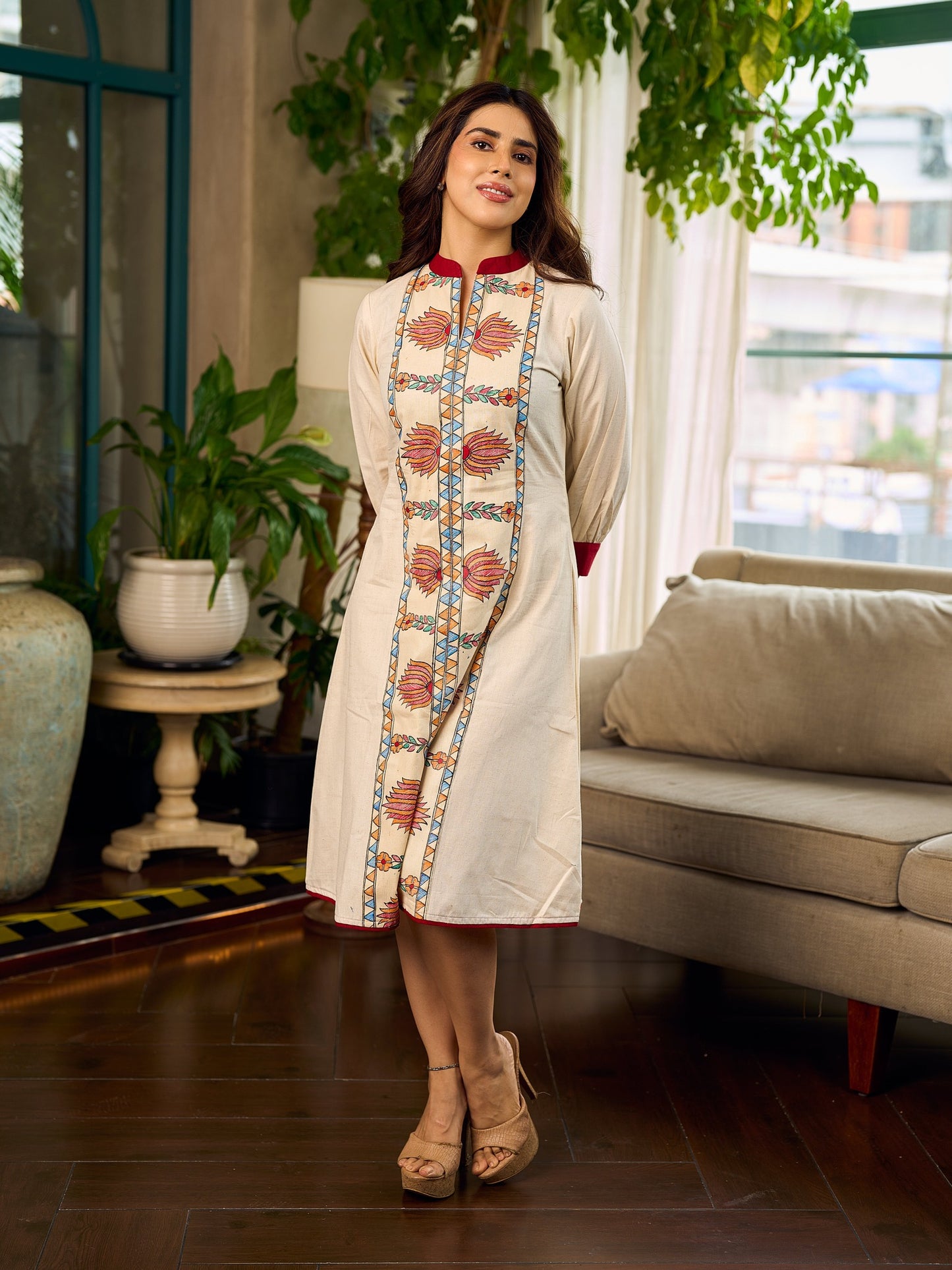 Artisan-crafted off-white Madhubani dress with beautiful hand-painted motifs and trim.