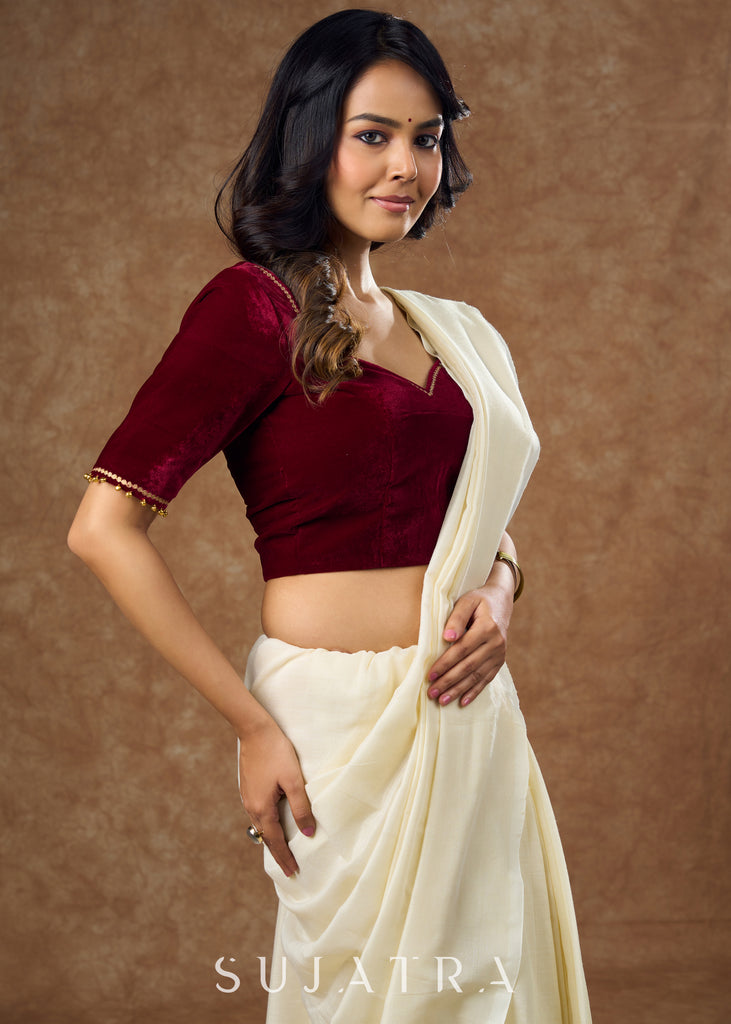 Rich maroon velvet blouse with subtle embroidery & gold detailing on sleeves