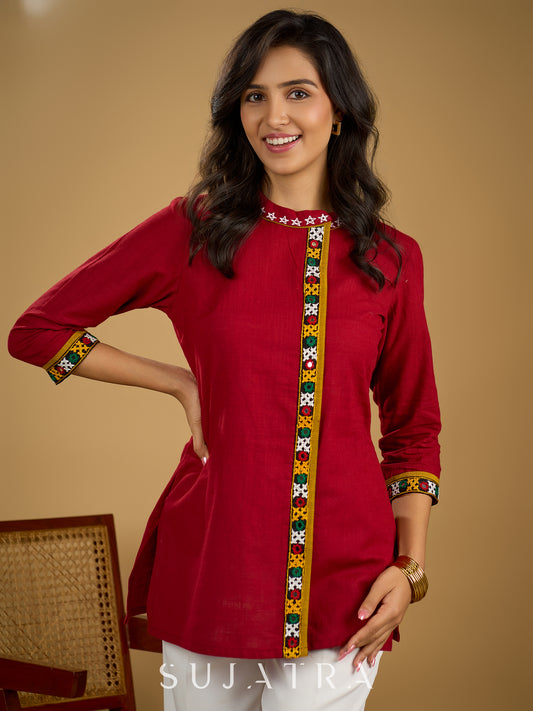 Elegant maroon cotton top featuring mirror work and side collar.