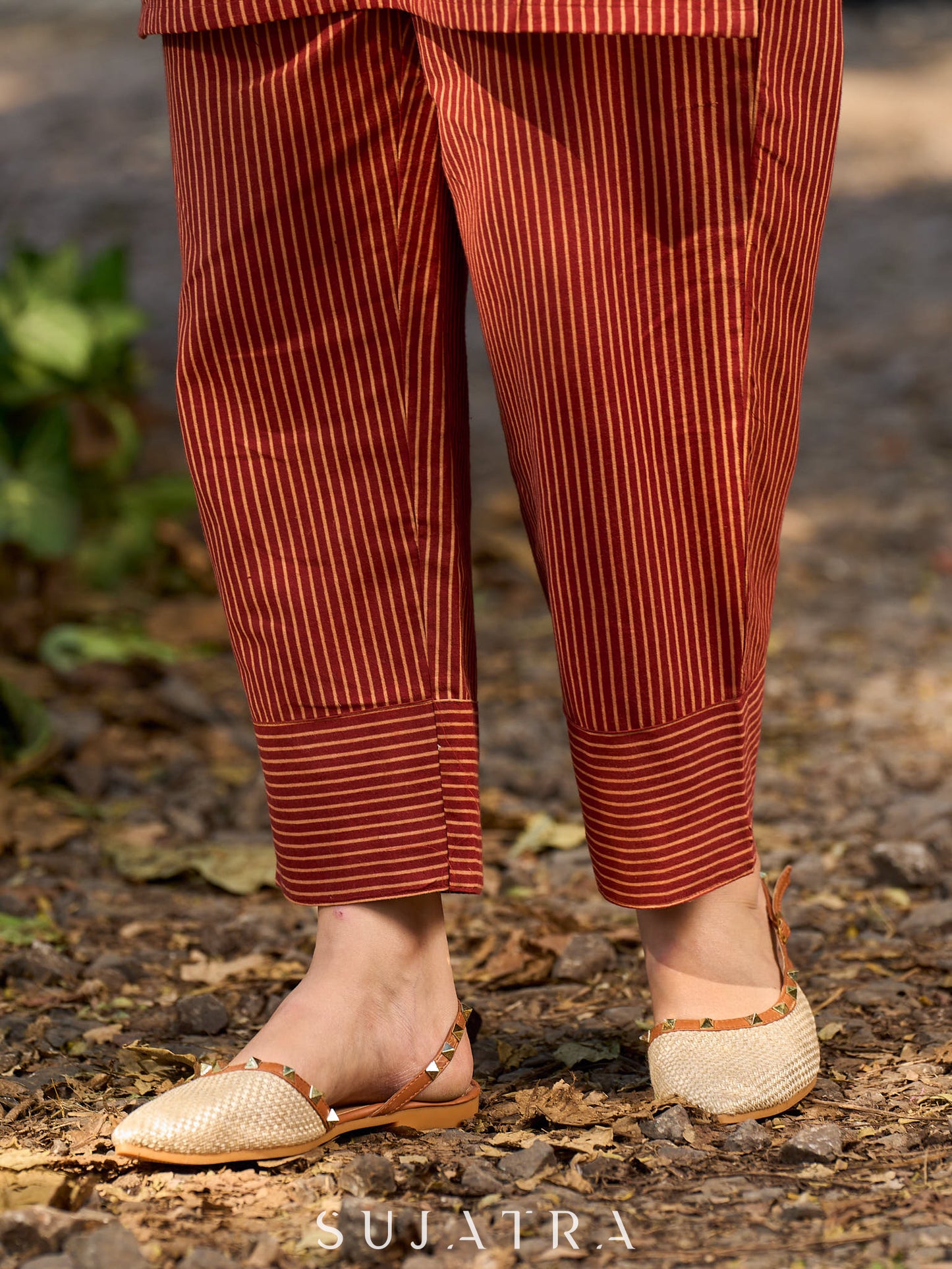 Handcrafted Maroon Ajrakh stripe kurta with a black floral patch