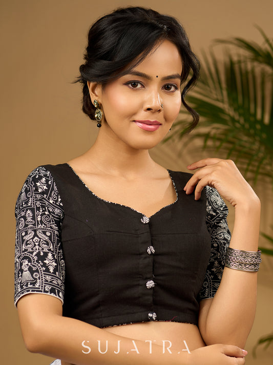 Stunning black cotton hand embroidered blouse with warli printed sleeve.