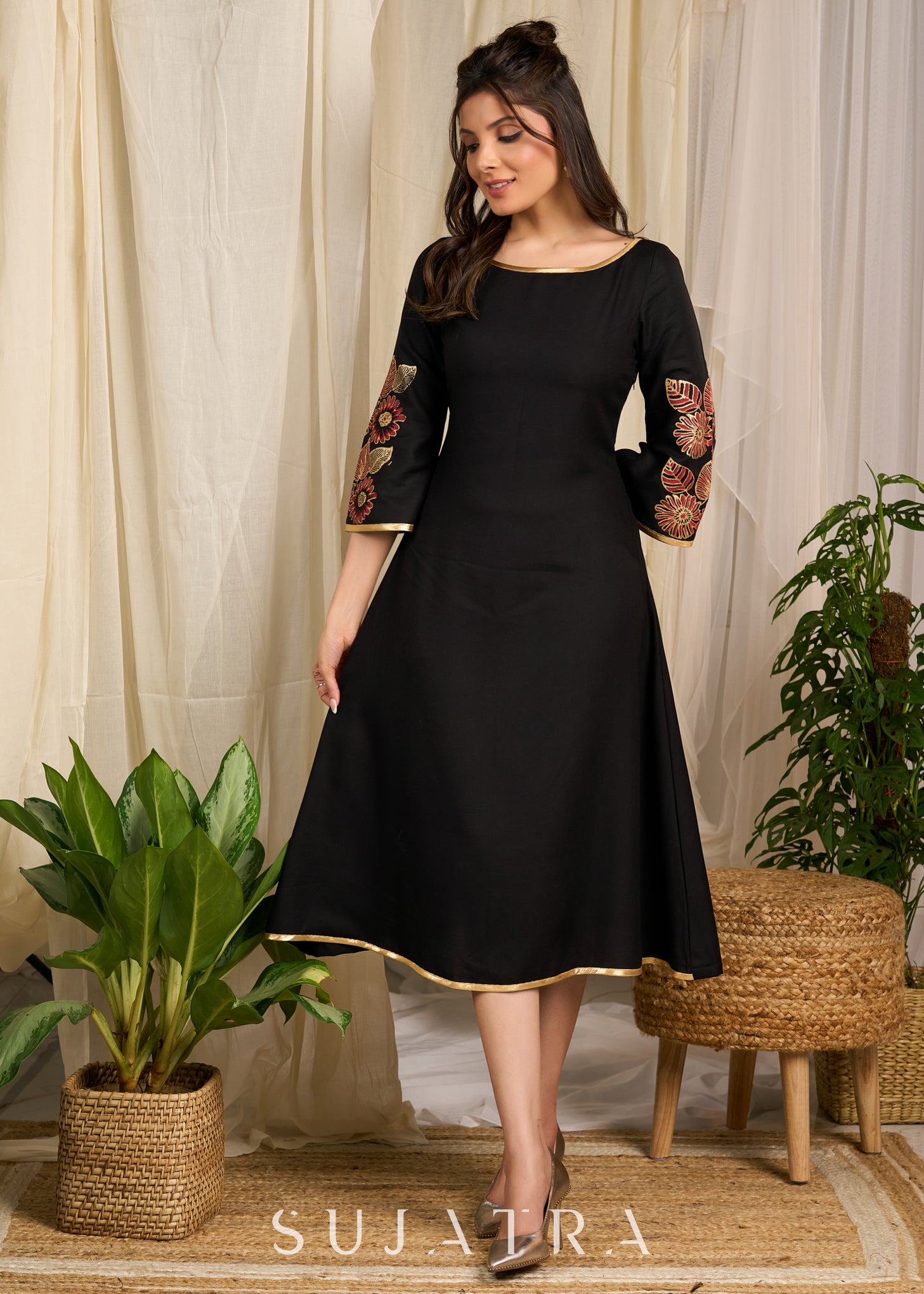 Classic black dress with vibrant floral block print and gold detailing Sujatra Classic black dress with vibrant floral block print and gold detailing Sujatra