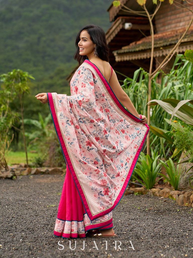 Floral-inspired white saree elevated with fuchsia pleats and borders