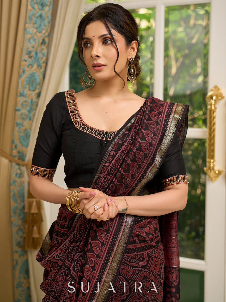 Pure Maheshwari saree with bold Ajrakh prints and regal zari border