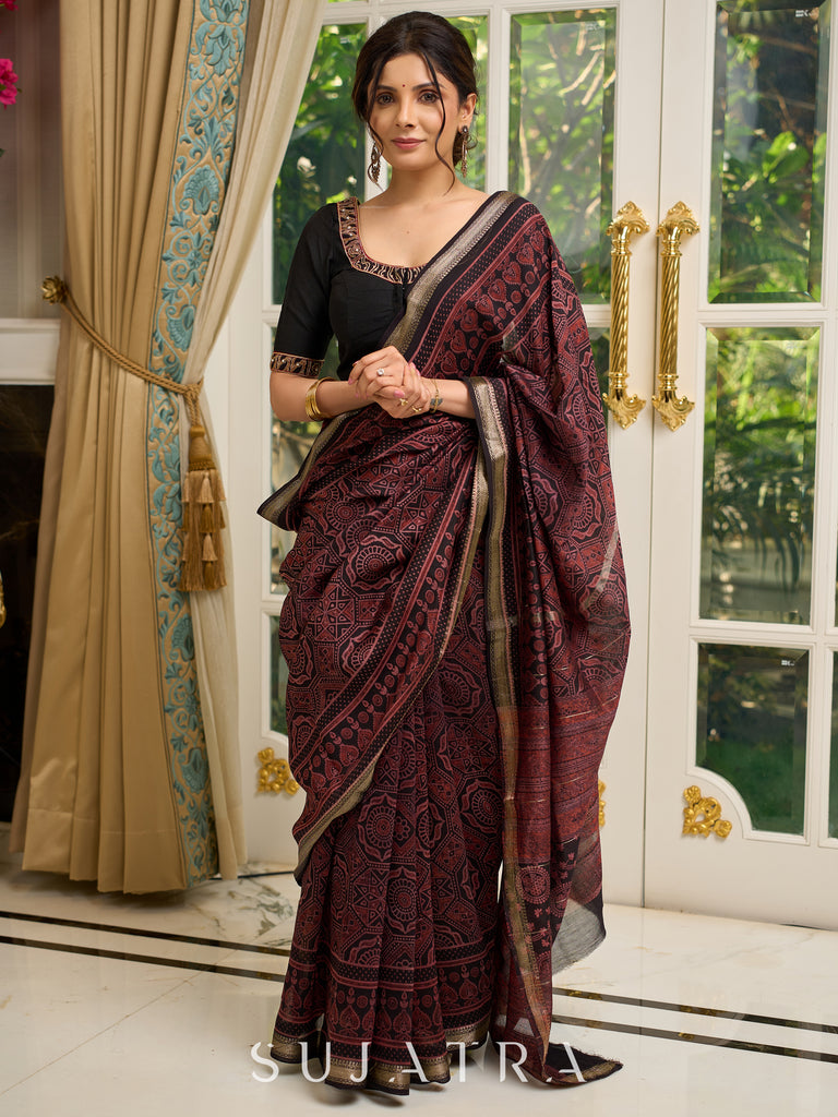 Pure Maheshwari saree with bold Ajrakh prints and regal zari border