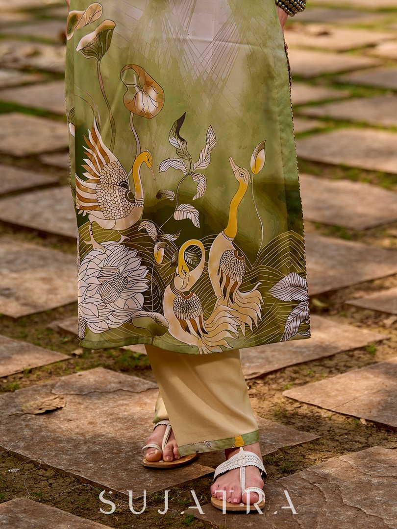 Minimal beige pants elevated with tasteful green border detailing.