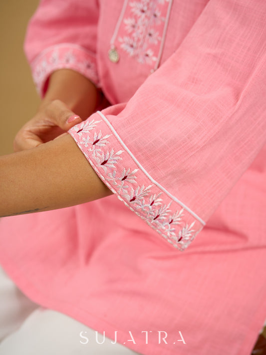 Elegant baby pink cotton top highlighted with subtle thread embroidery