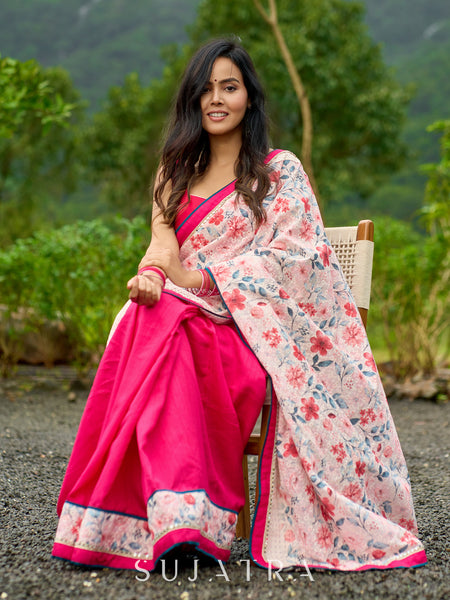 Floral-inspired white saree elevated with fuchsia pleats and borders