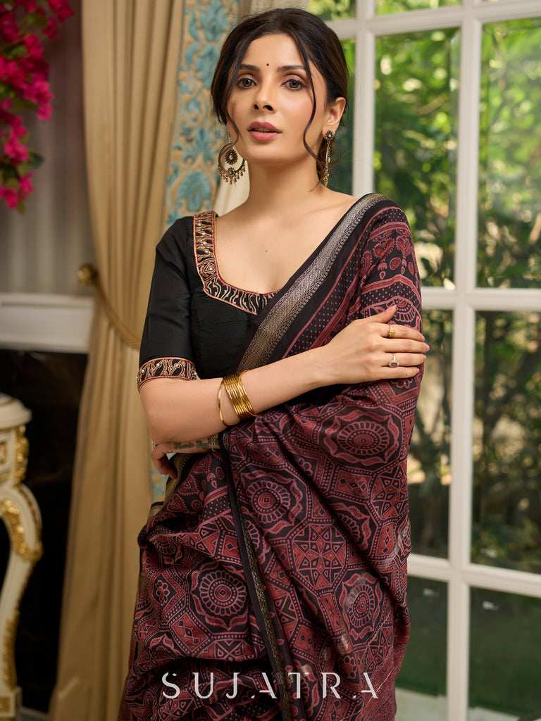 Pure Maheshwari saree with bold Ajrakh prints and regal zari border