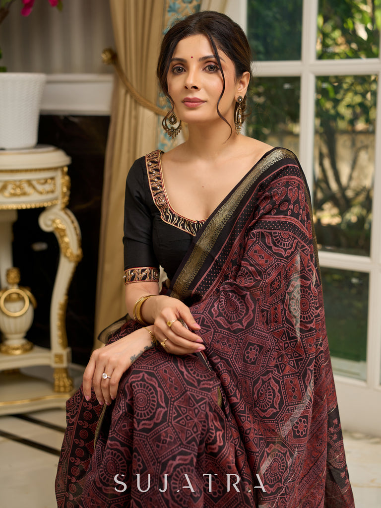 Pure Maheshwari saree with bold Ajrakh prints and regal zari border