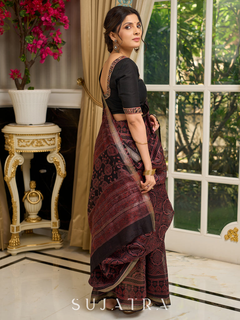 Pure Maheshwari saree with bold Ajrakh prints and regal zari border