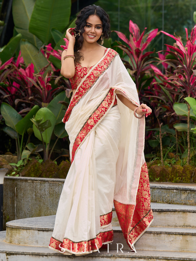 Ivory elegance with royal red Banarasi border, timeless festive glamour