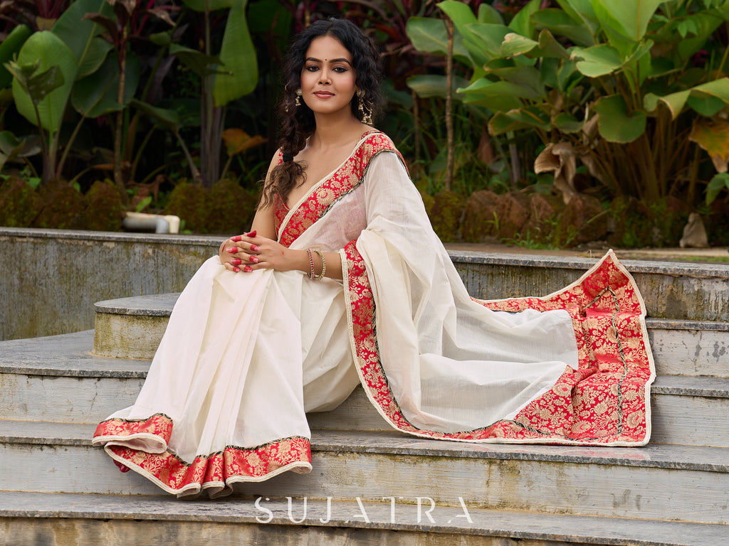 Ivory elegance with royal red Banarasi border, timeless festive glamour