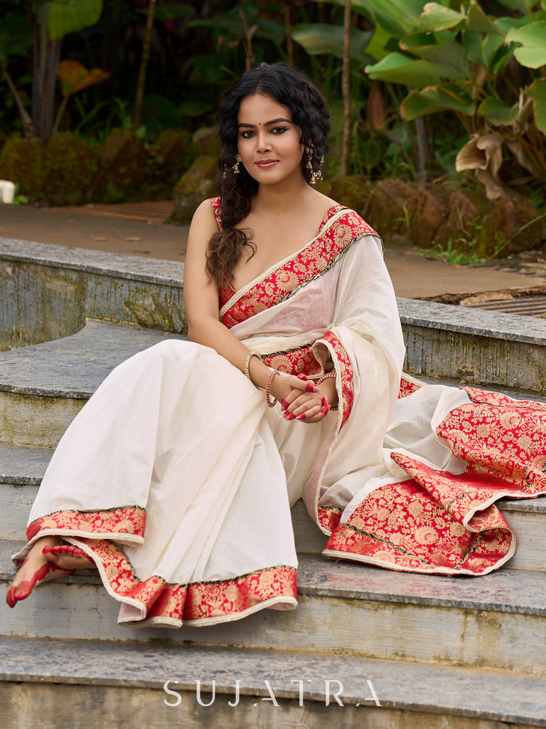 Ivory elegance with royal red Banarasi border, timeless festive glamour