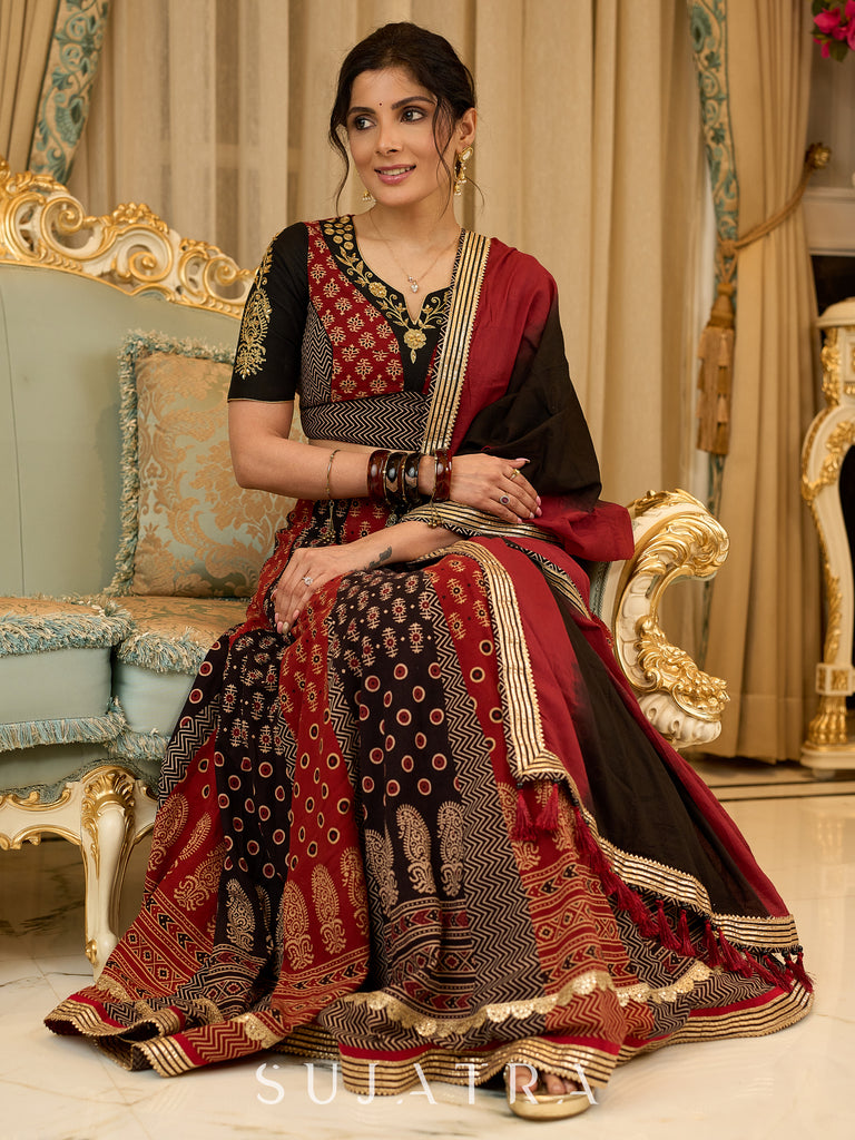 Handcrafted maroon & black Ajrakh print lehenga paired with an embroidered blouse for rich artisanal look - Dupatta Optional