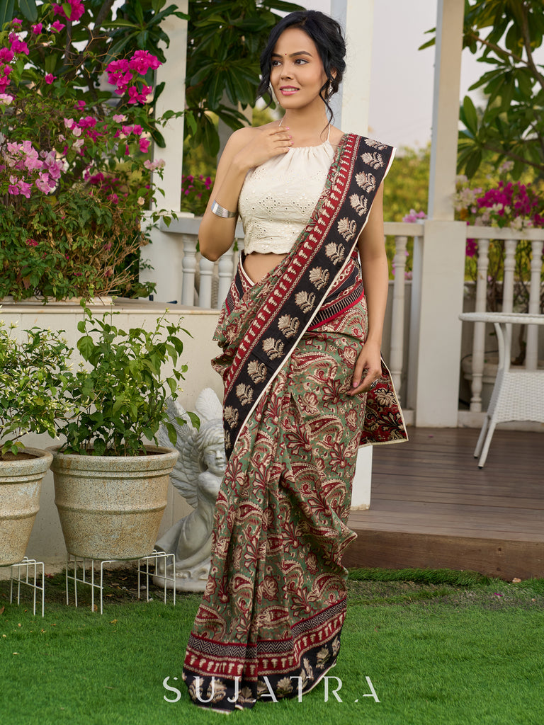 Exquisite green paisley cotton saree with contrast black pallu and border