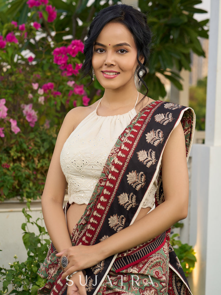 Exquisite green paisley cotton saree with contrast black pallu and border