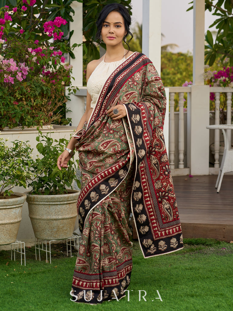 Exquisite green paisley cotton saree with contrast black pallu and border