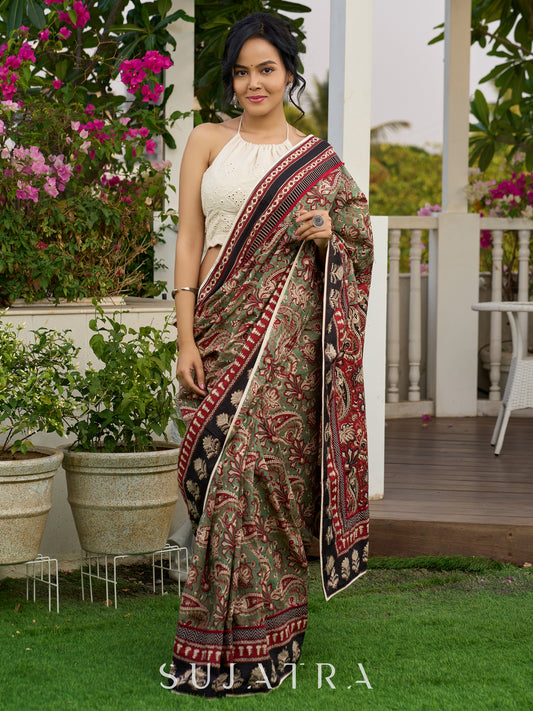 Exquisite green paisley cotton saree with contrast black pallu and border
