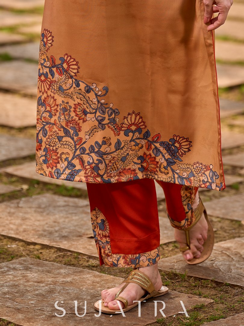Soft, flowy orange rayon pants with a slit finished with elegant border detailing