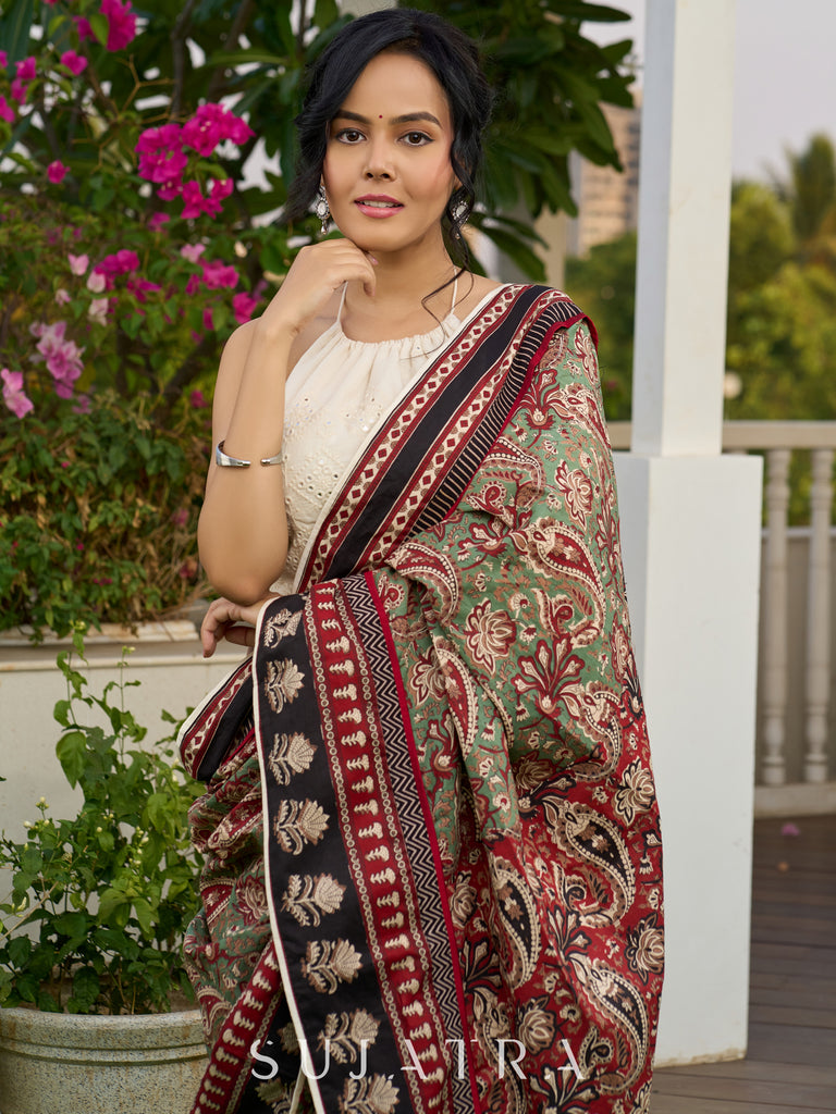 Exquisite green paisley cotton saree with contrast black pallu and border