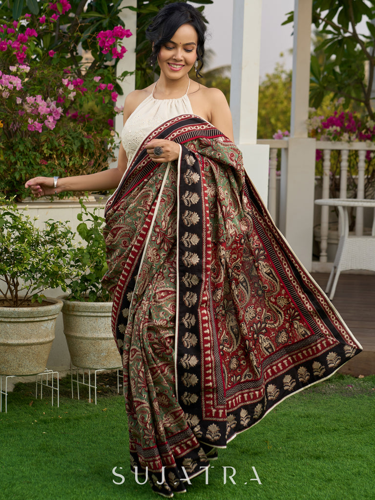 Exquisite green paisley cotton saree with contrast black pallu and border
