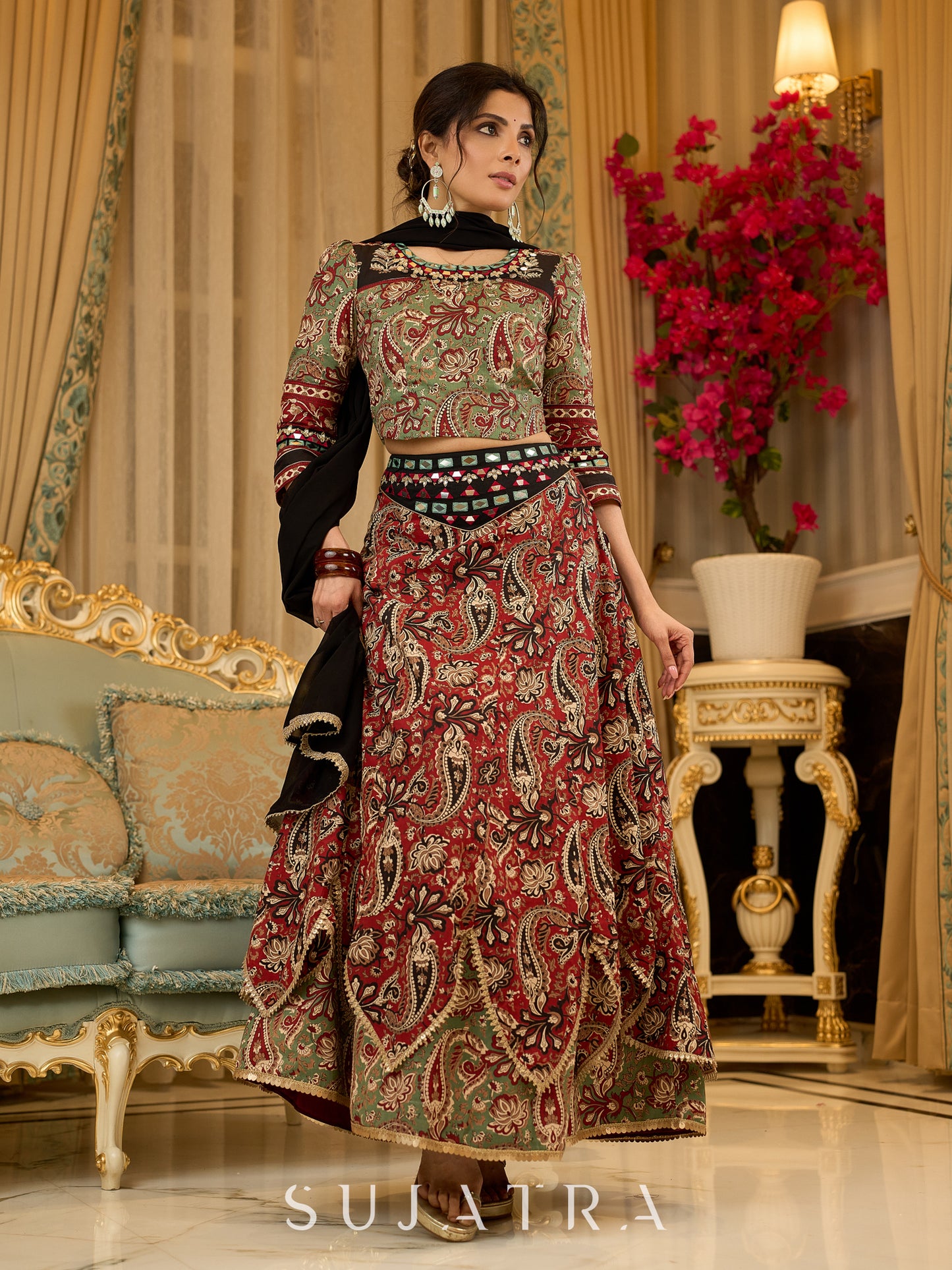 Contemporary folkloric ensemble featuring a petal cut block printed lehenga with mirror work accents - Embroidered Dupatta Optional