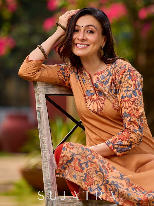 Elegant mustard kurta featuring Kalamkari print in an asymmetrical layout