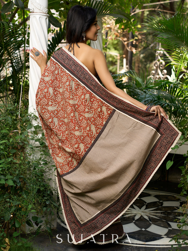 Earthy block-printed cotton saree with paisley charm and rustic elegance