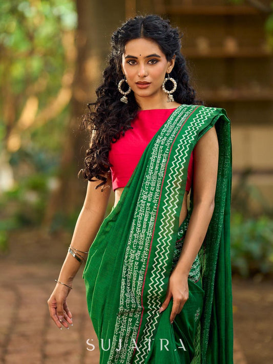 Refined Green Cotton Saree with Hand Block Printed Slogan Border & Contrasting Pink Accents