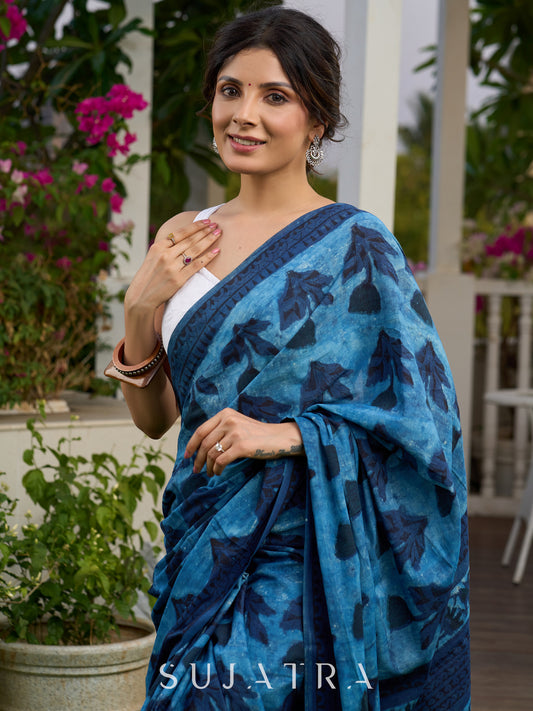 Hand block printed cotton saree in blue symphony and striking motifs