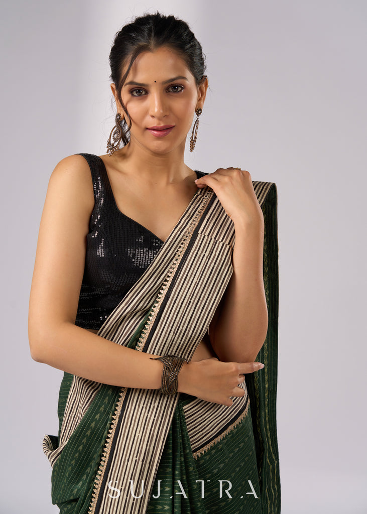 Elegant green cotton saree with intricate striped border & zari highlights
