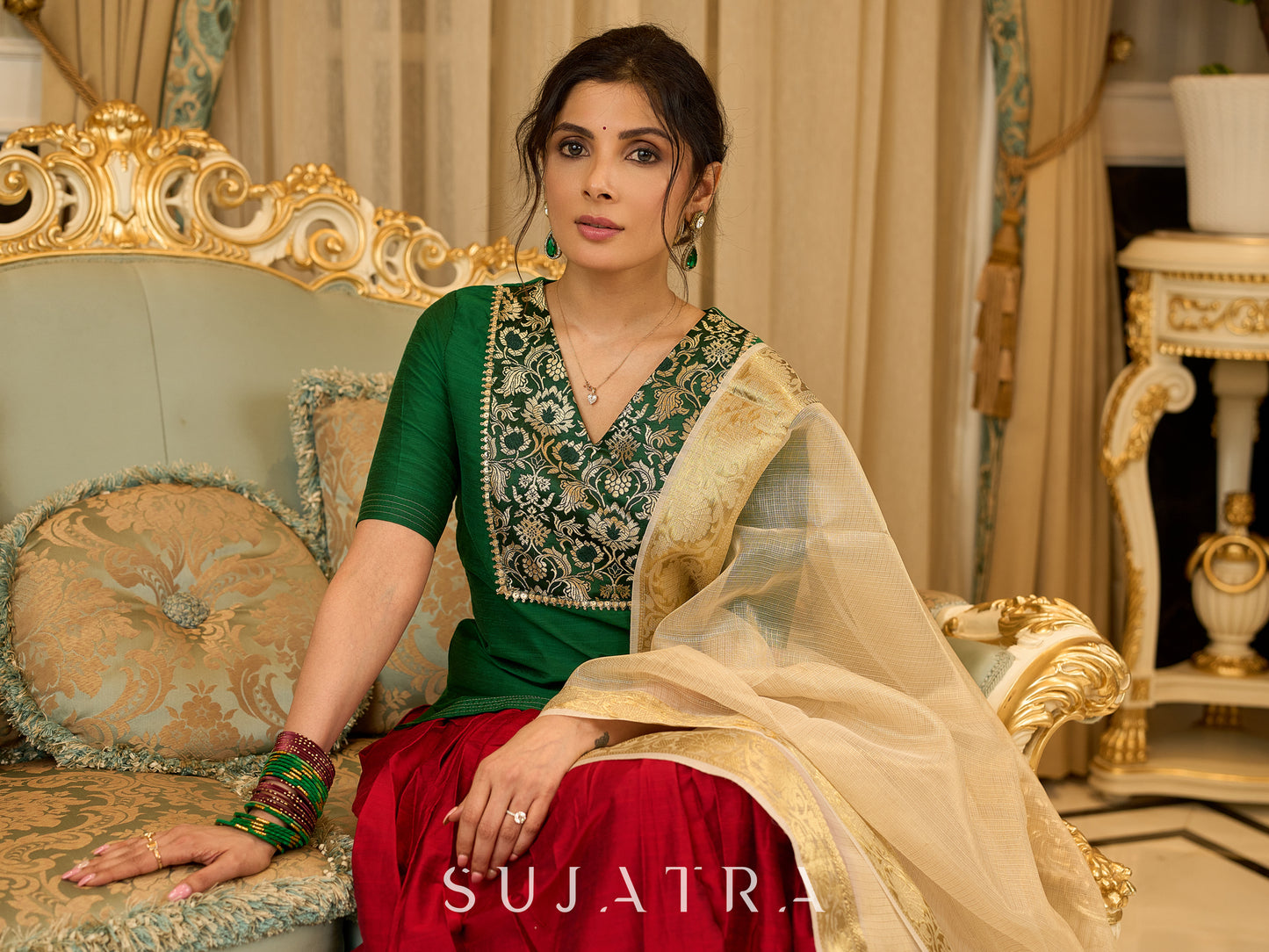 A traditional look featuring a red Cotton silk lehenga with a green Cotton silk choli with brocade yoke - Contrast dupatta optional