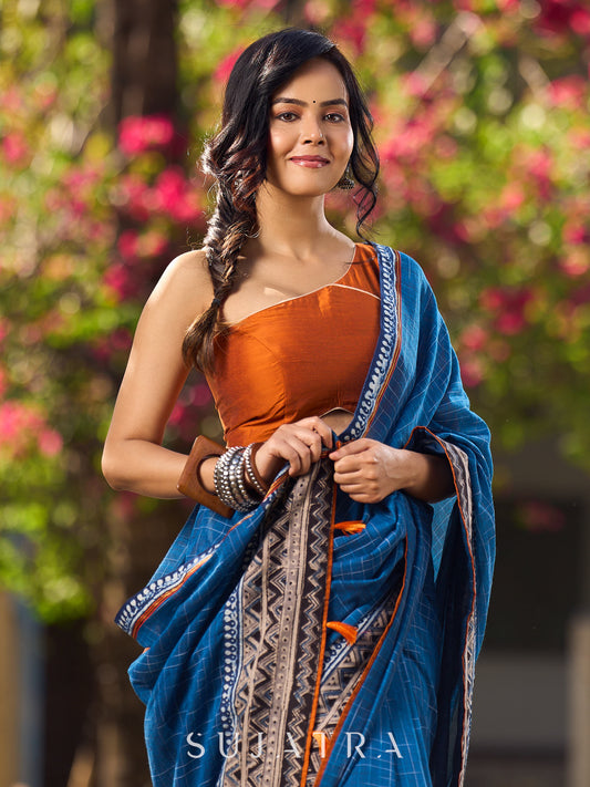Elegant Blue Saree with Geometric Kalamkari Border and Contrasting Orange Accents