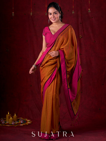 Autumn Rust Mul Cotton Saree with Pink Striped Border, Delicate Black Detailing & Tassel Highlights