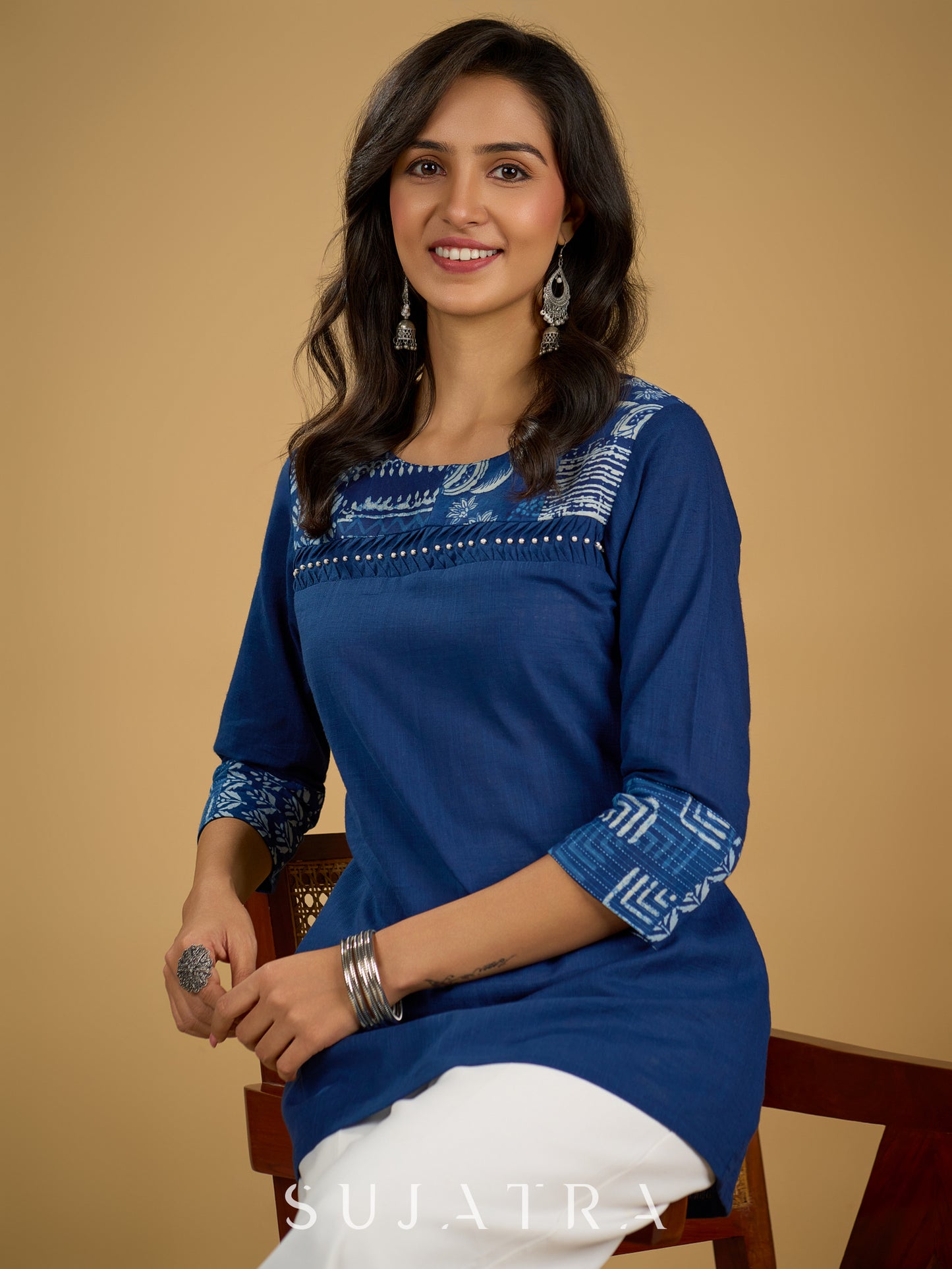 Classic indigo cotton patchwork top with subtle pearl highlights