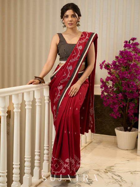 Exquisite Jamdani saree in regal red with intricate motifs and lace borders