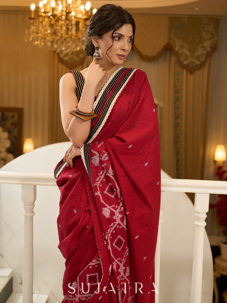 Exquisite Jamdani saree in regal red with intricate motifs and lace borders
