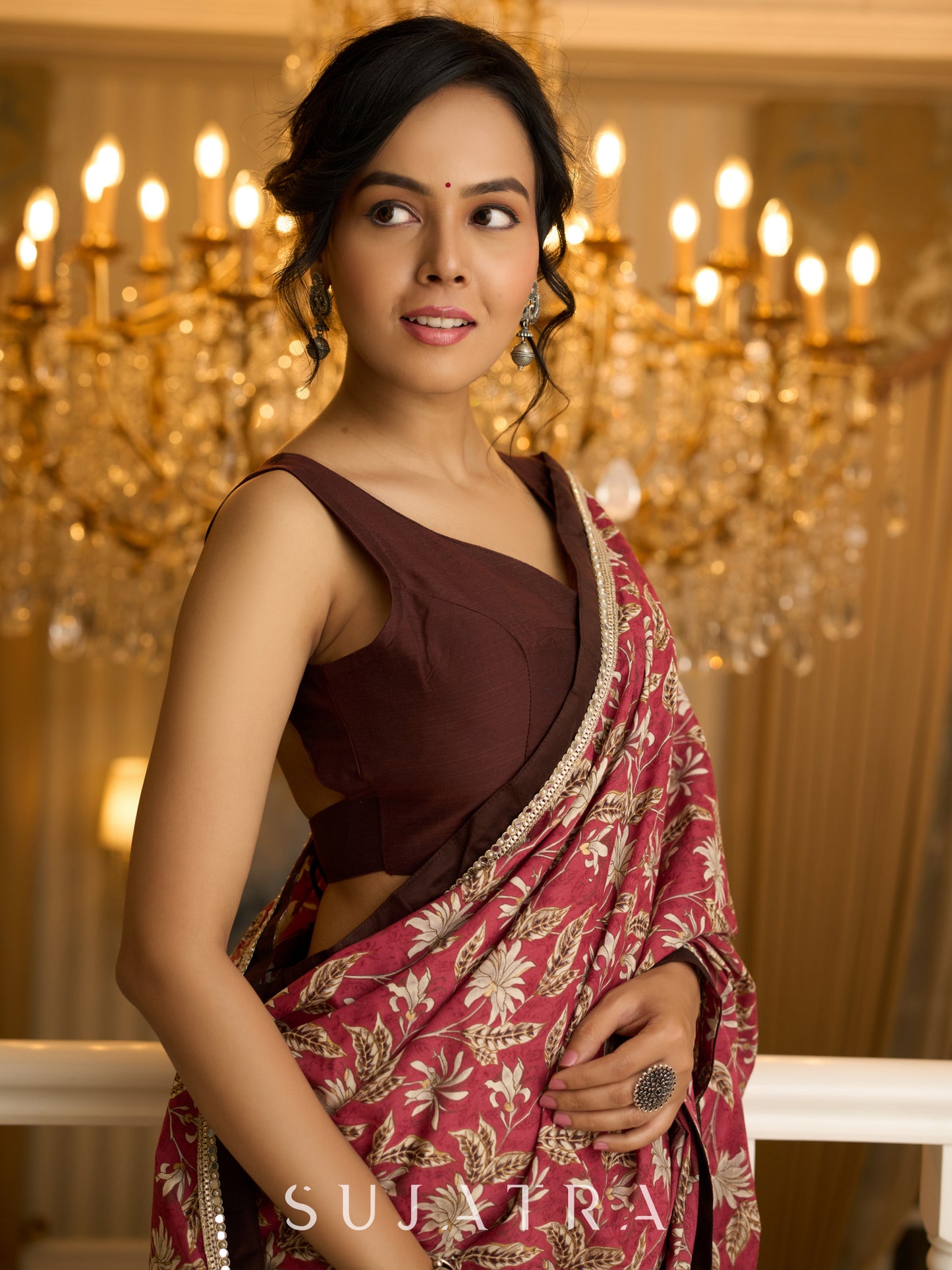 Ivory elegance meets rich pink florals in this exclusive cotton saree