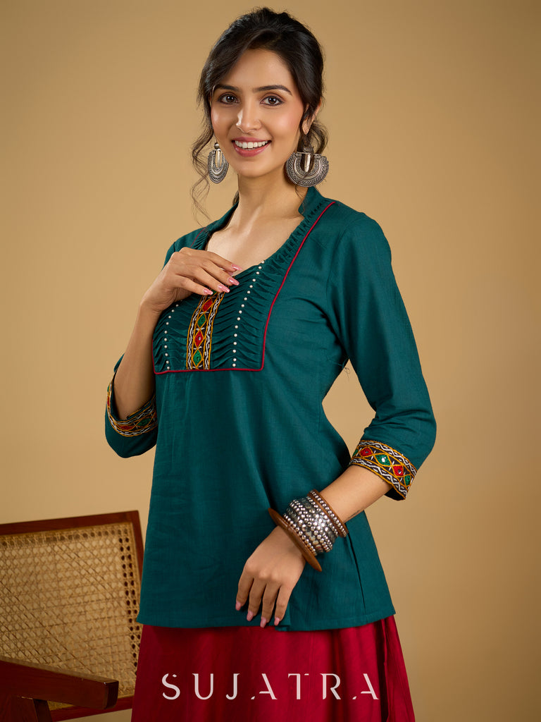 Stylish dark green cotton top with pleats,mirror,and pearl work - Skirt optional