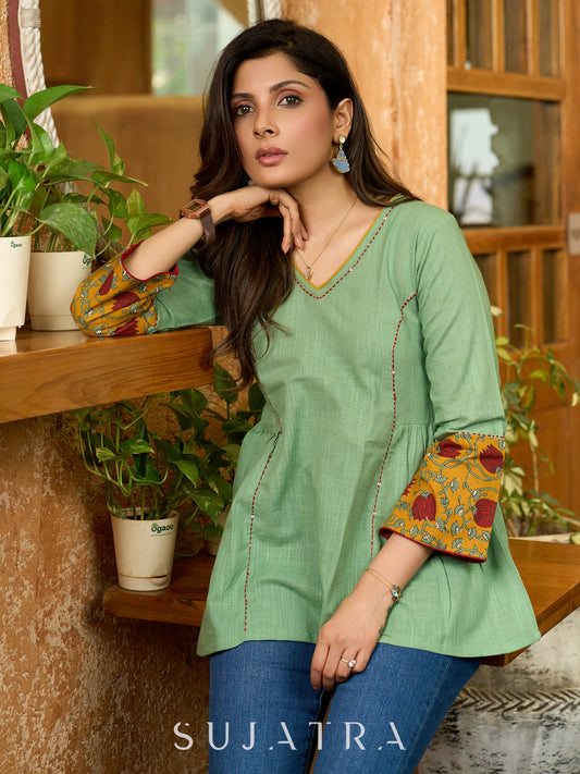 Green Artisan Cotton Top with Contrast Mustard Floral Printed Sleeves and Delicate Embellishments and Hand Embroidered Kantha