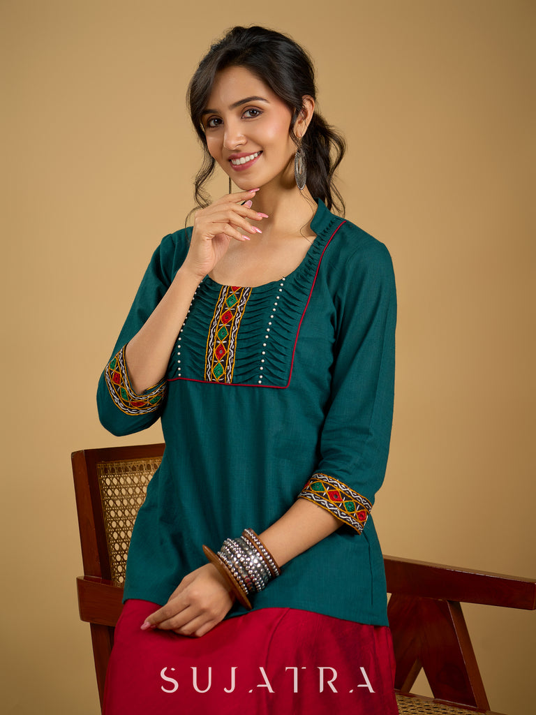 Stylish dark green cotton top with pleats,mirror,and pearl work - Skirt optional