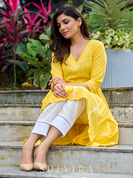 Lemon yellow pleated kurta accented with delicate lace detailing-pant optional