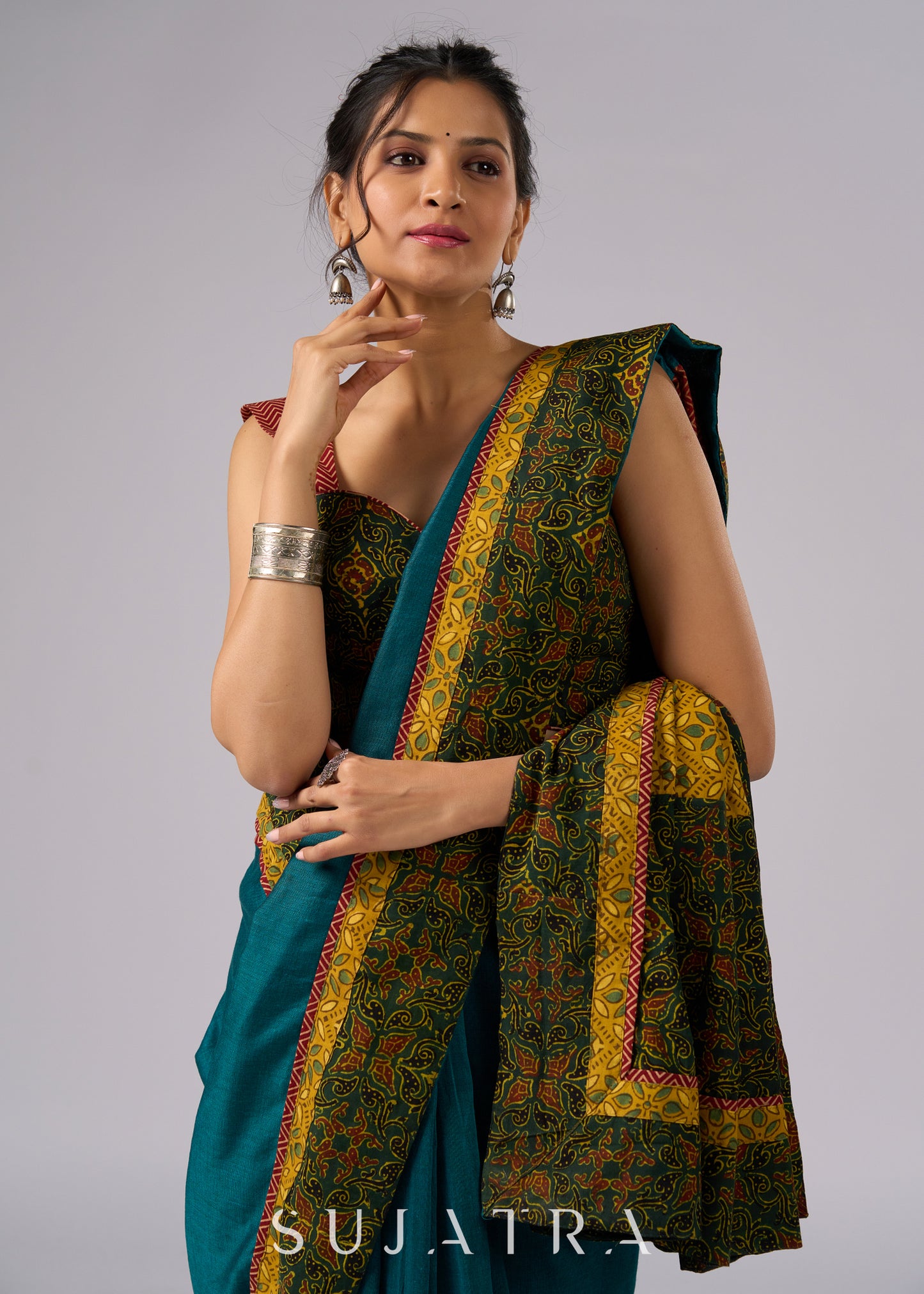 Exclusive green cotton saree with Ajrakh patchwork border