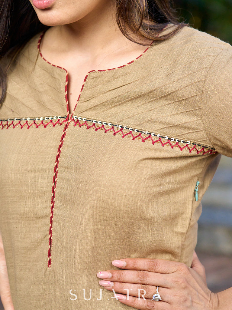 Hand-embroidered dark beige kurta featuring elegant pintuck detailing -pant optional
